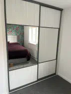 Whitewood 1/4 panels with mirror in the middle with charcoal frames, installed in Newton Aycliffe